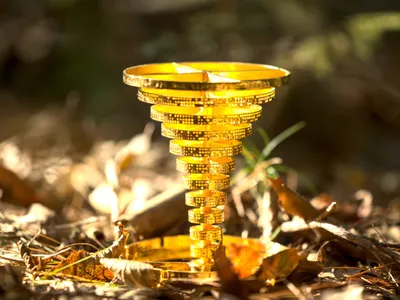 The 24-karat gold spiral statuette is inscribed with a message pointing the finder to more than $87,000 worth of Bitcoin.