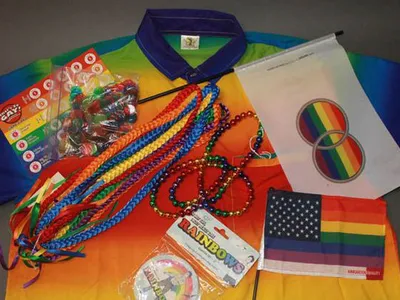 Miscellaneous objects from the museum’s collection that feature rainbows, including “That’s So Gay!” trivia game, coasters, and flags promoting marriage equality and immigration equality