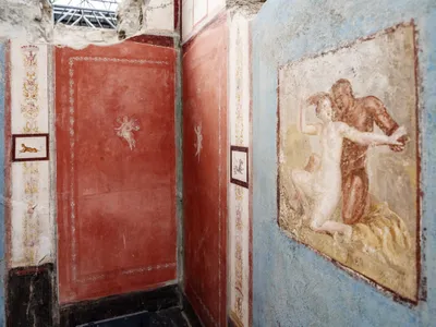 One fresco depicts a satyr and a nymph embracing.