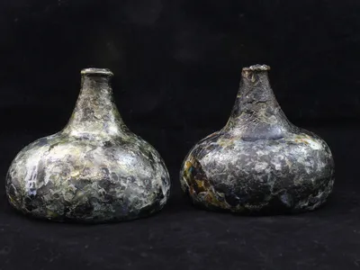 Layers of glass were flaking off the bottles due to a process known as &quot;delamination.&quot; Conservators coated the artifacts with an acrylic resin to help preserve them.