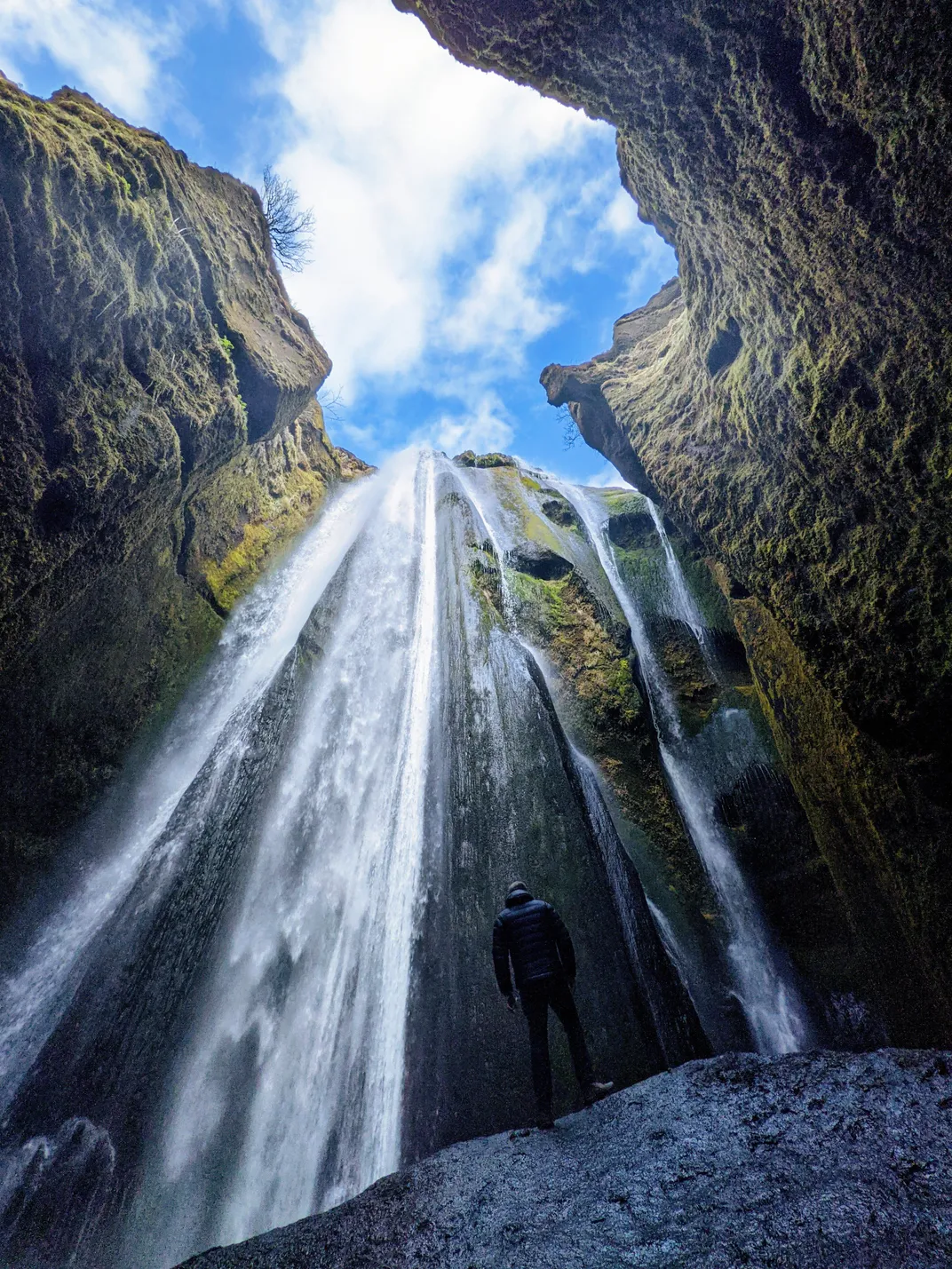 a waterfall spilling from the sky above.