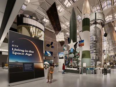 A rendering of the upcoming RTX Living in the Space Age Hall at Smithsonian&#39;s Air and Space Museum, featuring the New Shepard rocket booster.