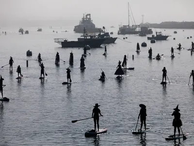 Around Halloween, hundreds of revelers dress up as witches and warlocks and hit the water.

