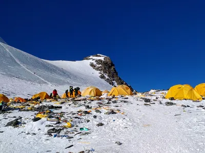 This picture taken on May 21, 2018 shows discarded climbing equipment and rubbish scattered around Camp 4 of Mount Everest.