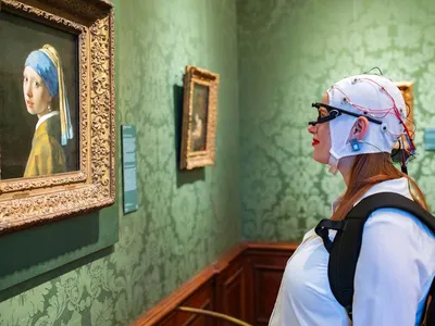 Volunteers looked at the original artworks in the museum and posters in the gift shop.