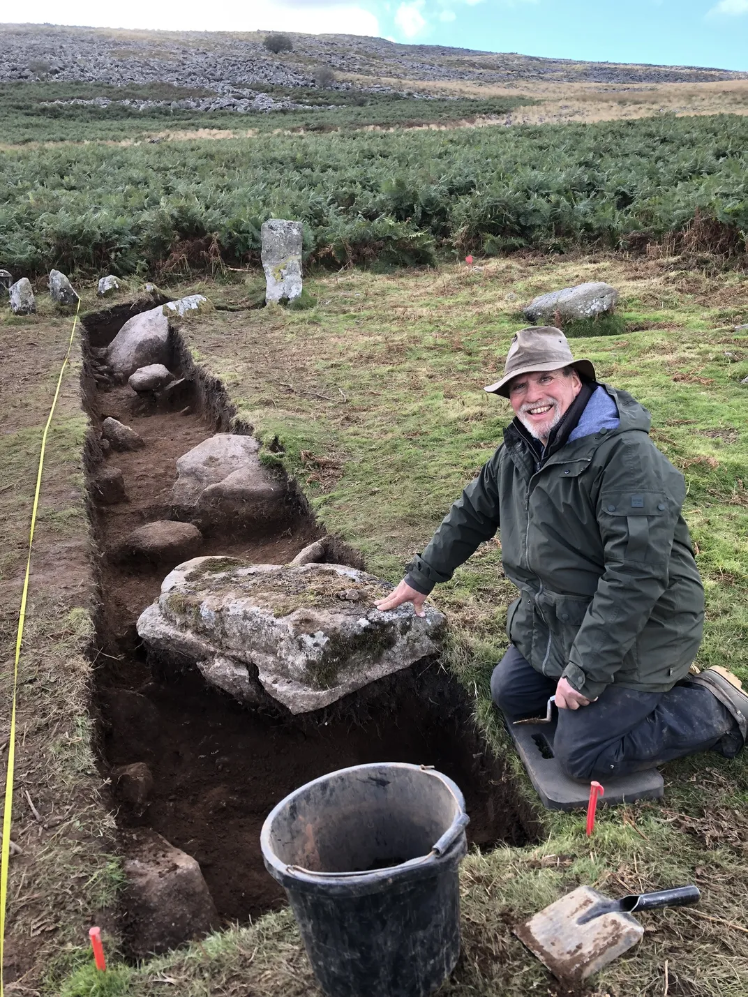 Alan Endacott next to one of the discovered stones.