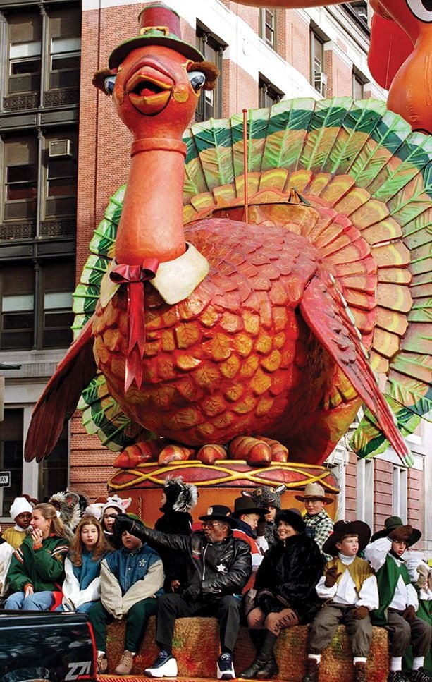 Bo Diddley sits on a Turkey float in a parade