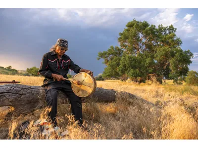 Phil Little Thunder, a great-great-grandchild of the Lakota chief whose village was attacked in 1855. An ancient cottonwood known as the Witness Tree, right, still stands.