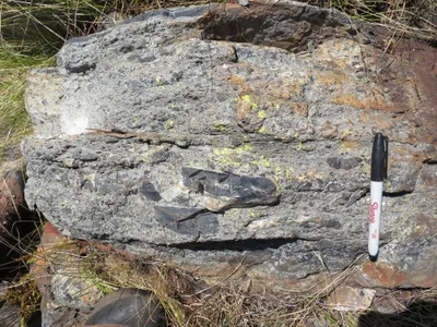 A rock layer showing the S2 impact tsunami bed with chunks of ripped-up seafloor