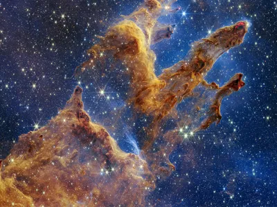 In a version of the iconic &quot;Pillars of Creation&quot; image, the James Webb Space Telescope turned its powerful near-infrared-light cameras on the Eagle Nebula in 2022.